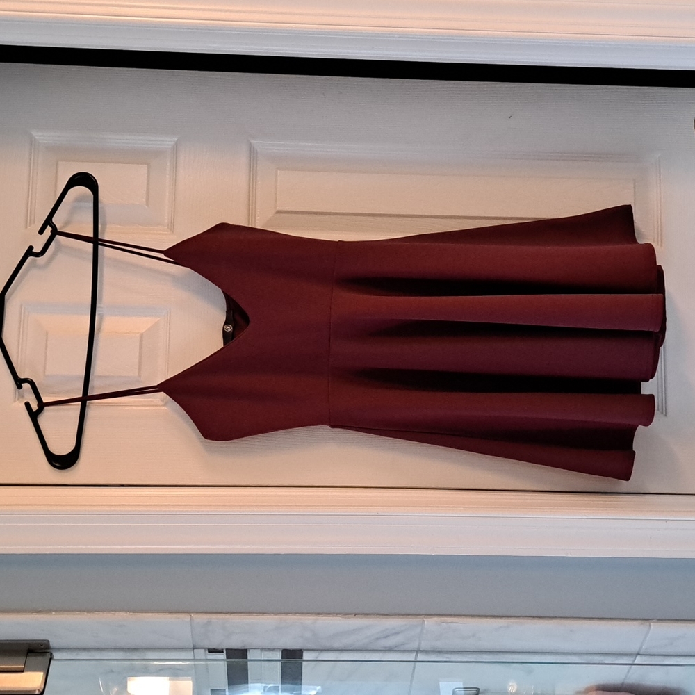 Mini dress size 2. Brand new with tags. Burgundy maroon color